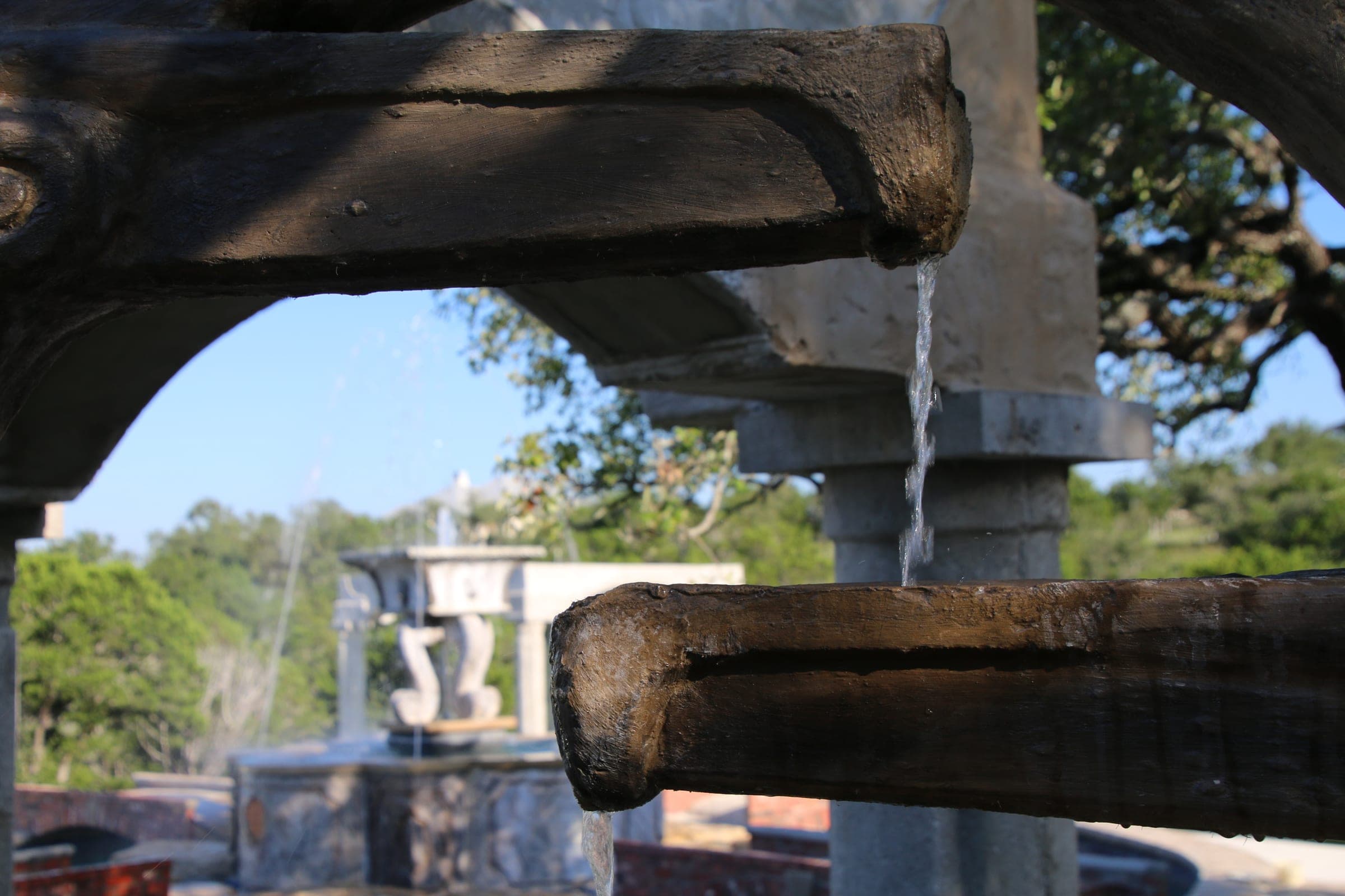 Stone water trough and fountain spout detail
