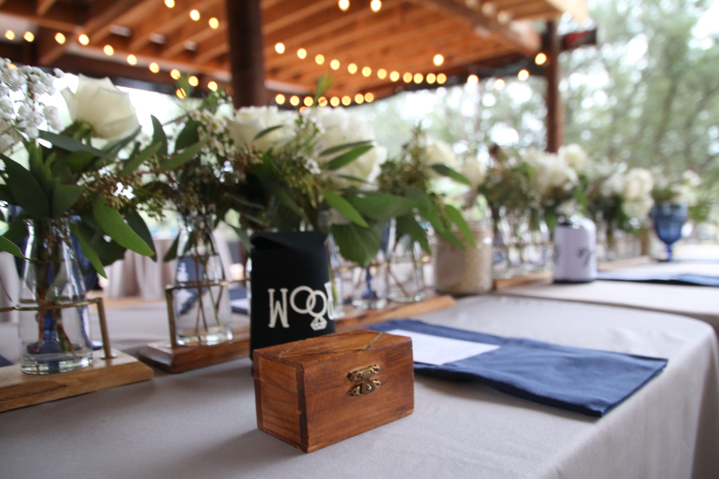 Reception table set with flowers and place settings