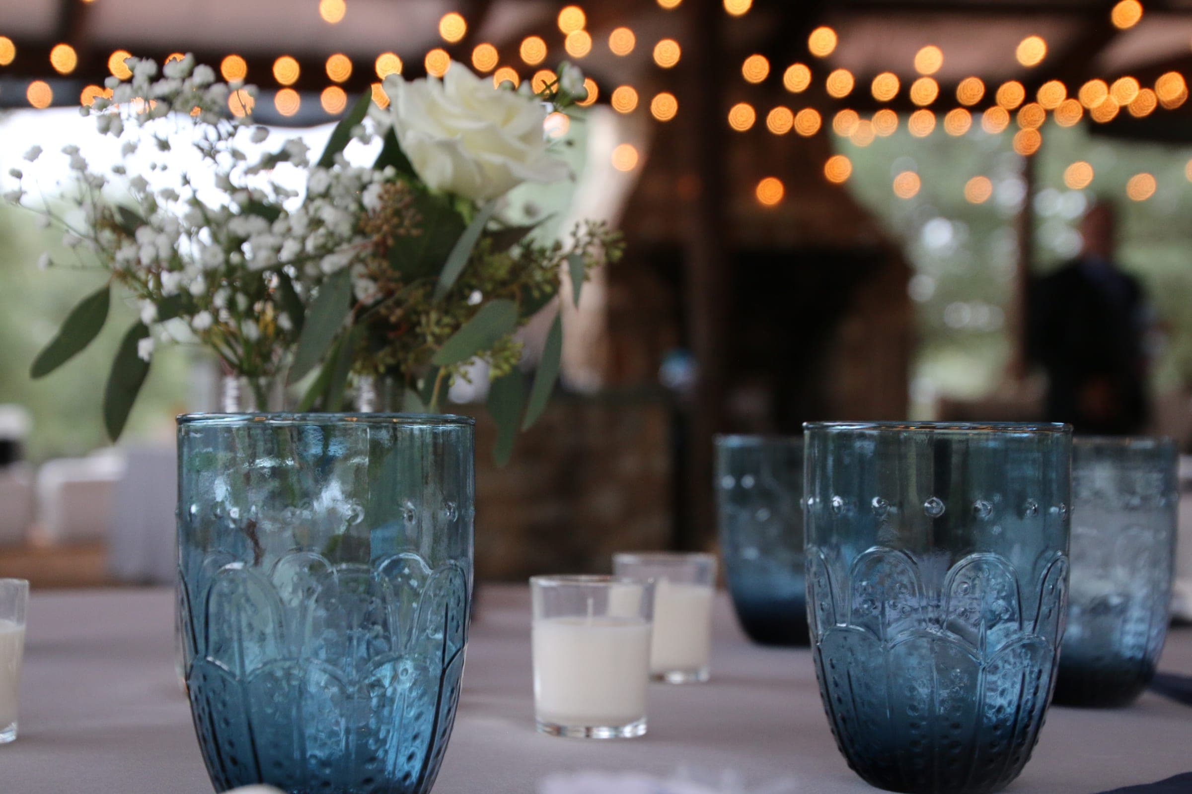 Reception table set with candles by the fireplace