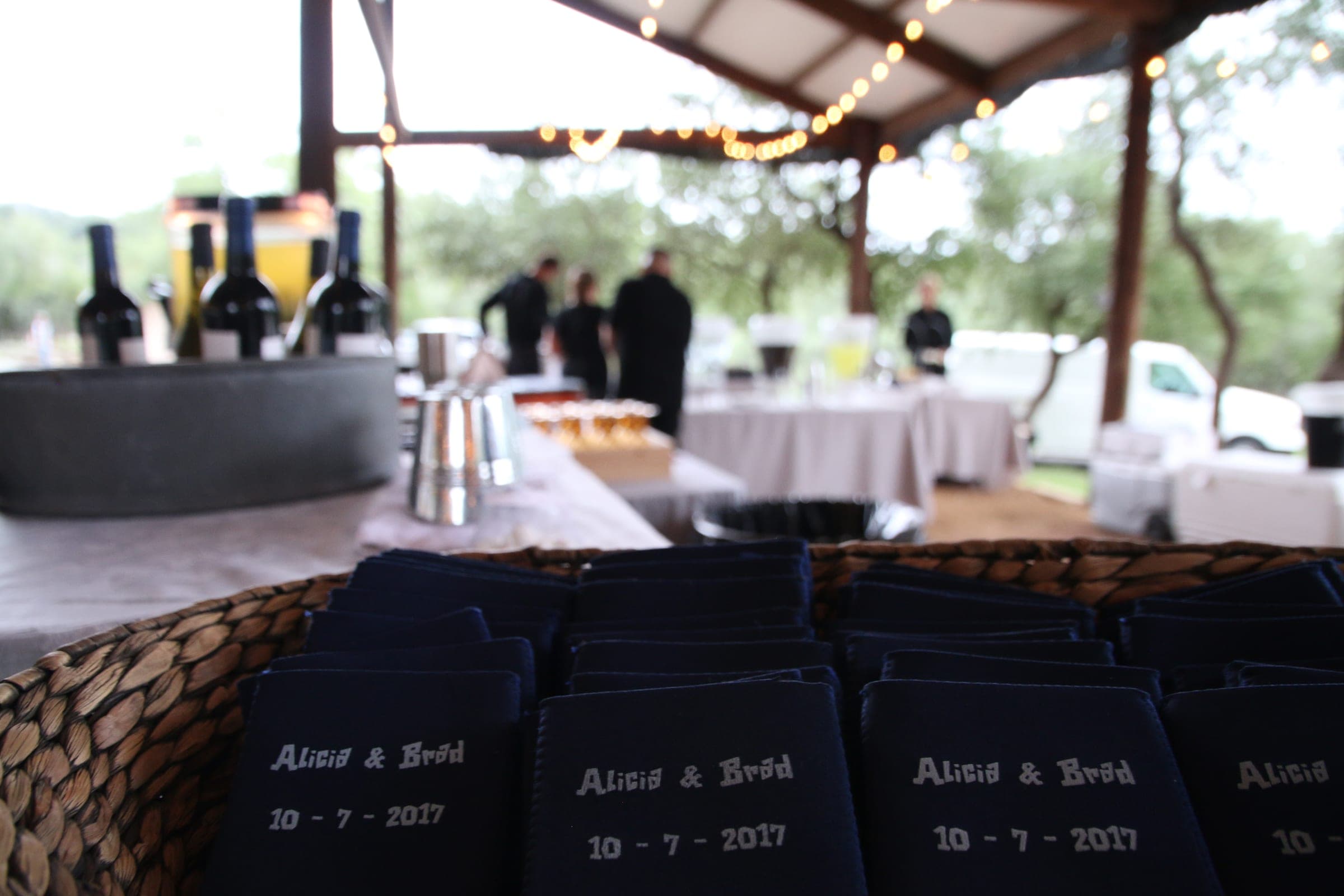 Bar service set up under the pavilion, string lights overhead