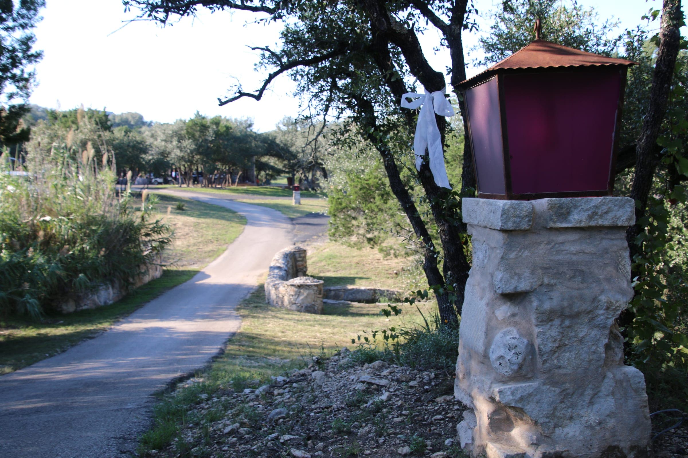 Entrance drive with stone pillar and lantern